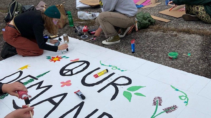 Woman making protest sign