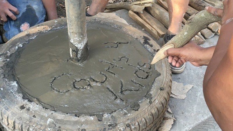 Writing in wet concrete