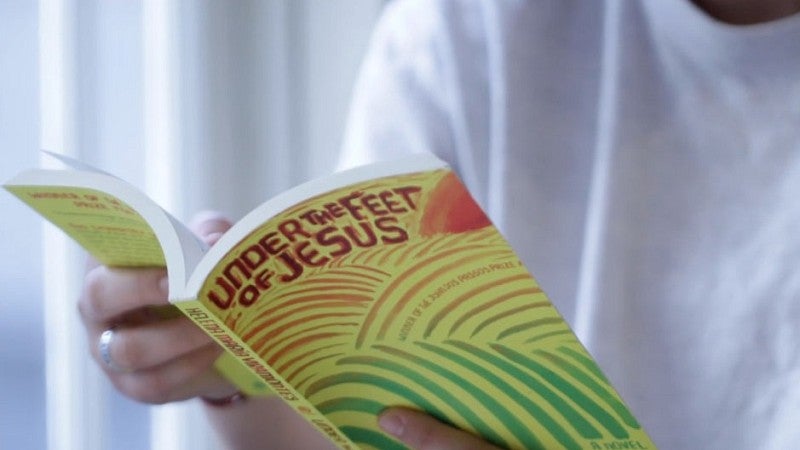 Person reading Common Reading Book 2019