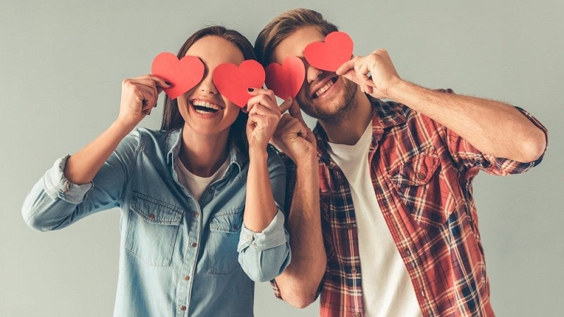 Couple with cut-out hearts