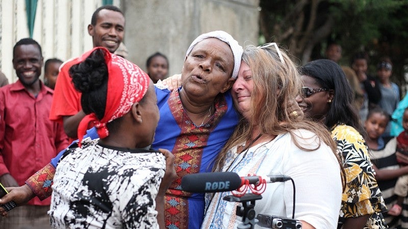 Griffith’s mother Abu greets Funk with a hug