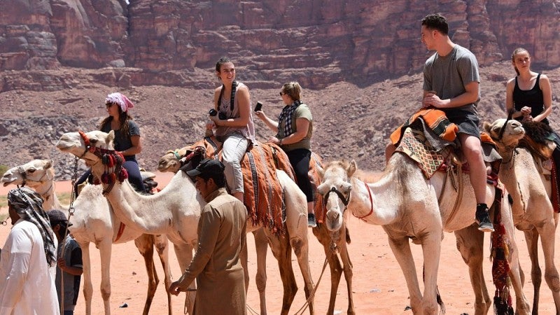 UO students on camels in Jordan