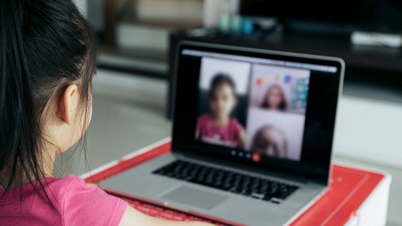 Girl during Zoom session on laptop