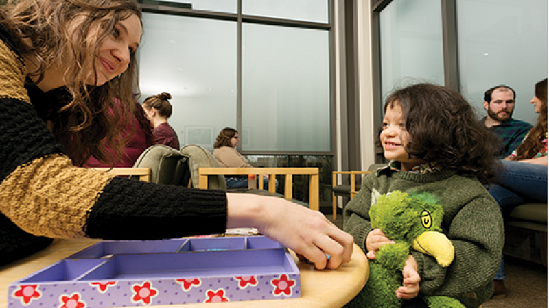 A HEDCO clinic worker with a child