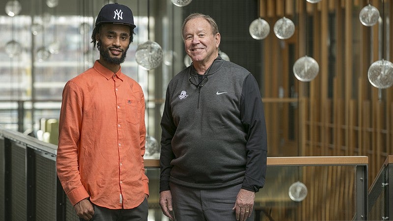 Kena Gomalo of the Black Student Task Force and UO supporter Dave Petrone.