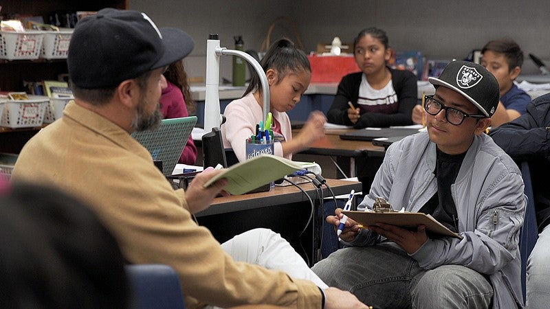 Middle school student conducting interview