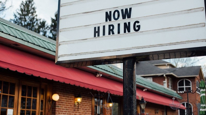 'Now Hiring' readerboard sign