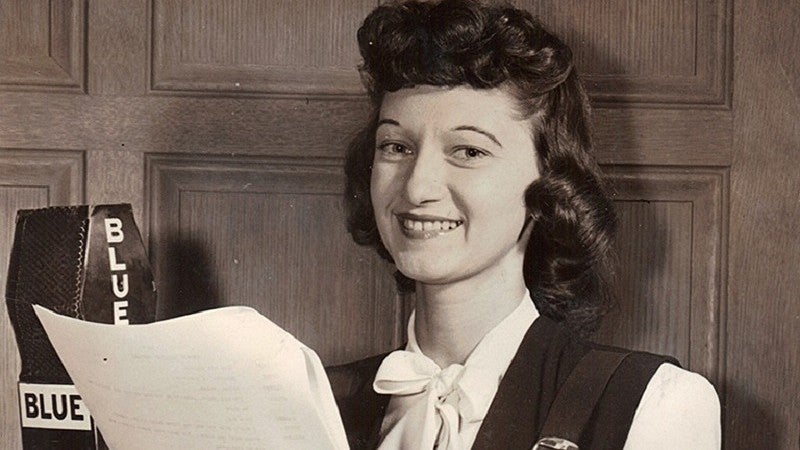 Peg Lynch with script and radio microphone.