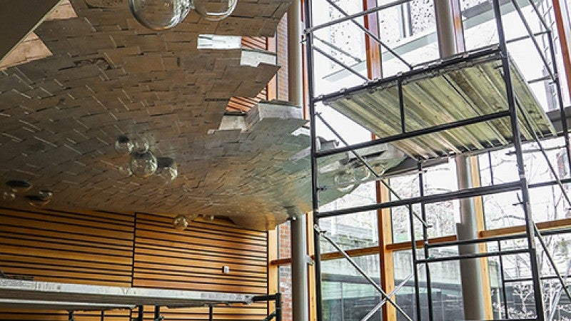 The waterfall is in the stairway leading to the underground library