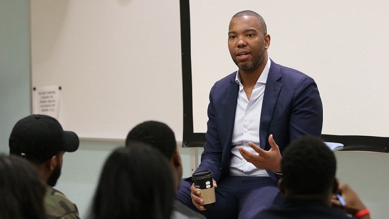 Coates speaking with journalism students