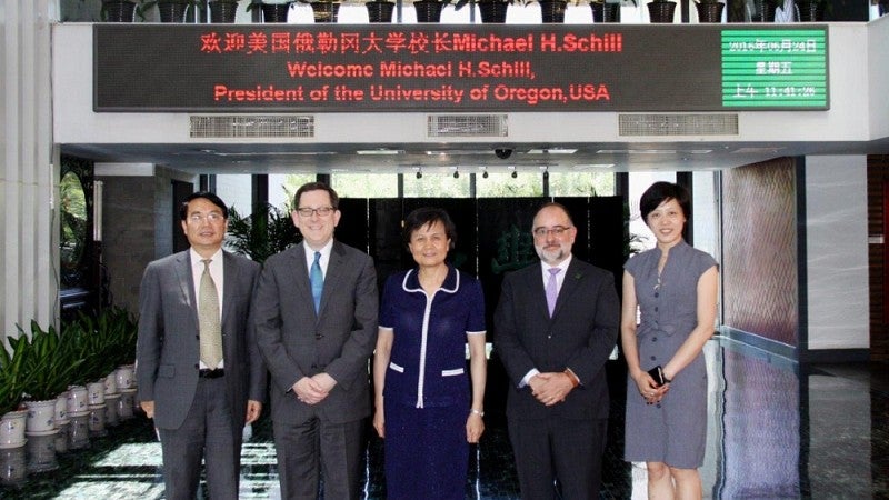 President Michael Schill with education officials in Asia