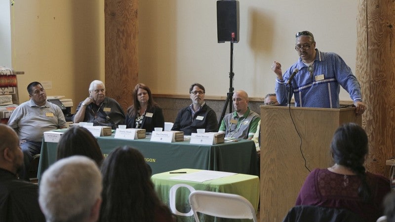 Jason Younker, a member of the Coquille Tribe, speaks at the signing ceremony