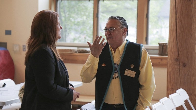 Reyn Leno of the Confederated Tribes of Grande Ronde talks with Brenda Meade of the Coquille Tribal Council