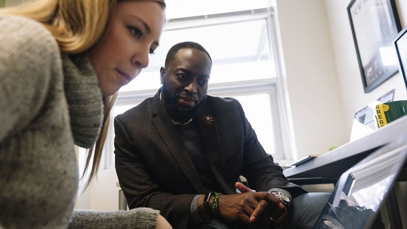 SOJC professor Troy Elias (right) and graduate student Dani Clarke 