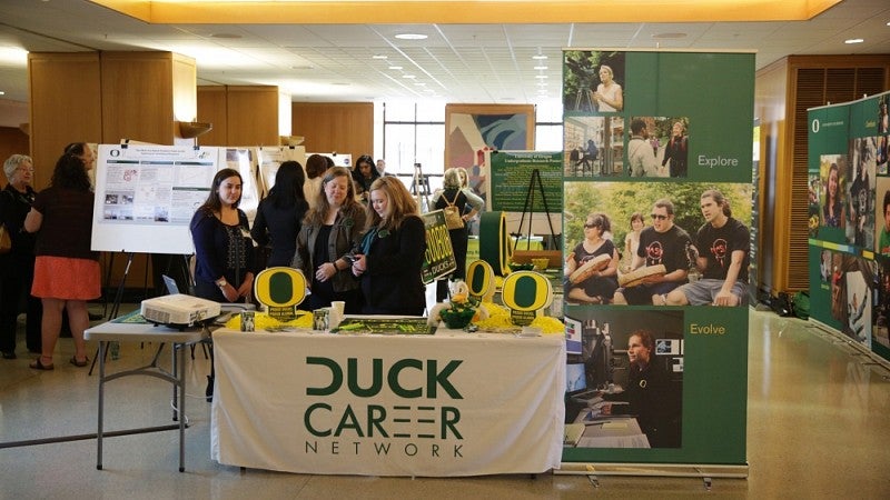 The UO Alumni Association table