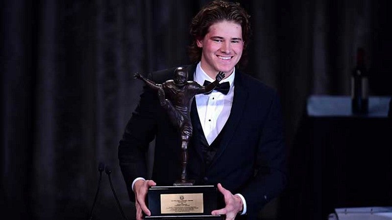 Justin Herbert with the Wiliam V. Campbell Trophy