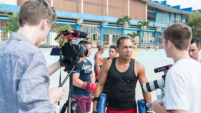 SOJC students interviewing Cuban boxers.