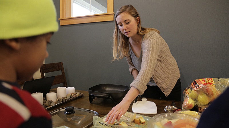 Kiara Kashuba preparing applesauce as part of a demonstration