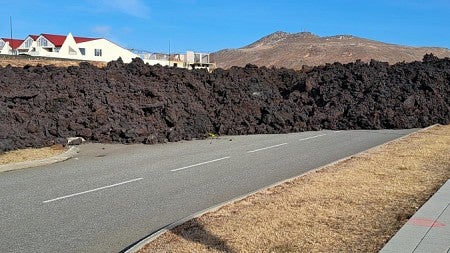 A wall of lava lies across a road