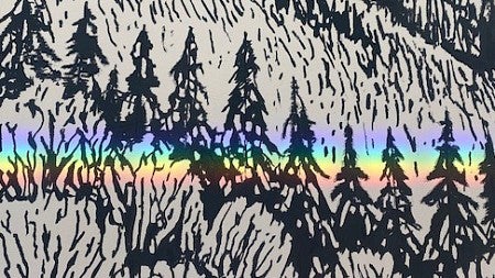 Refracted sun makes a rainbow across a mural with a mountainous image