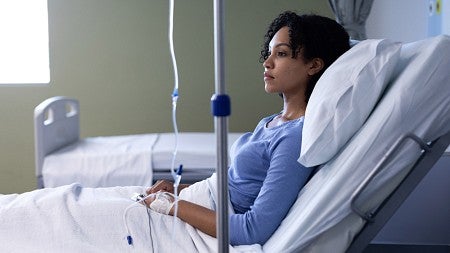 Black patient in hospital bed