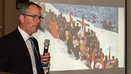 Mark Carey of the Clark Honors College speaks at the mountaineering award ceremony