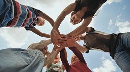 Children holding hands in a circle