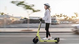 Woman riding scooter