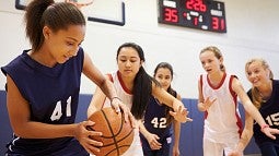 Young girls playing basketball