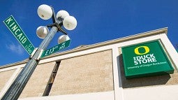 Kincaid Street and 13th Avenue street signs in front of The Duck Store