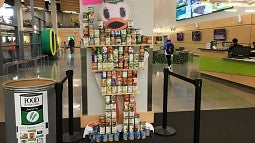 A duck sculpture made from canned food