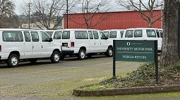 white vans in motor pool parking lot