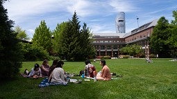 Students on lawn near Knight Law Center