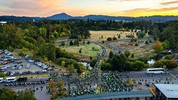 football fans walk into Autzen Stadium