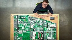 Steven Mack with his Lego model of the UO campus