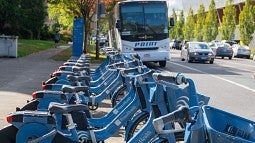 PeaceHealth Rides bicycles parked in front of a Point bus