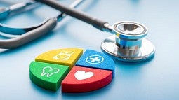 stethoscope next to colored health icons