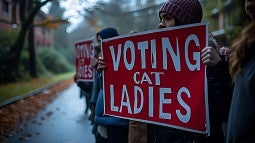 Protesters holding sign saying Voting Cat Ladies