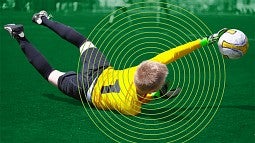 Youth soccer player falling on field, circles radiating from his head