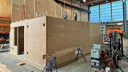 A prototype mass timber house under construction