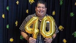 David Valdenegro holds "40" balloons