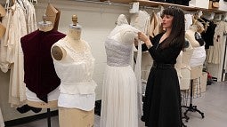 Costume shop manager Heather Bair with white dress