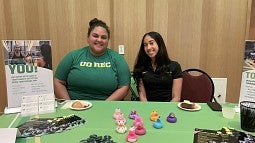 employees at rec center table at resource fair