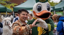 The Duck and a student throwing the O together