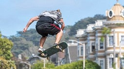 A skateboarder doing stunts
