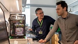 Paul Dalton, left, and Ievgenii Liashenko in their lab