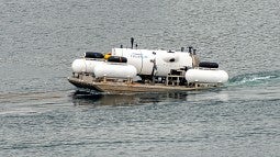 The Ocean Gate submersible being towed out to sea for Titantic dive