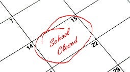 A calendar with a day marked with words school closed