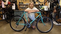 Senior Gavin Tycer, a bike mechanic with the Bike Program, restored this donated bike for the annual student bike sale this fall (photo: Matt Cooper, University Communications) 