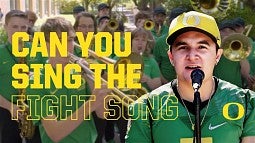 UO marching band with person singing at microphone